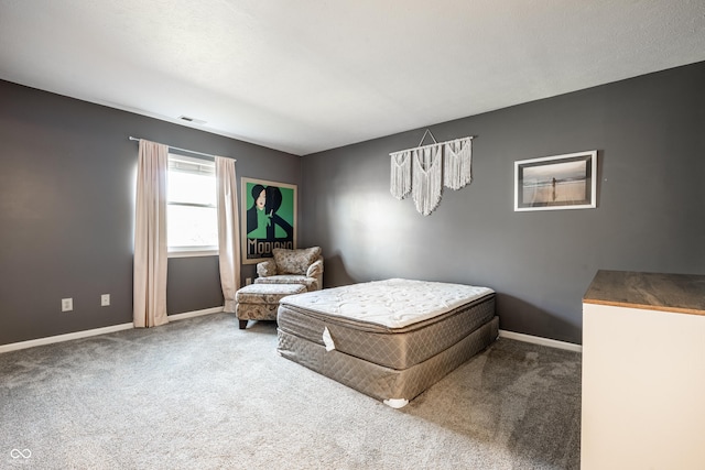 bedroom featuring baseboards, carpet flooring, and visible vents