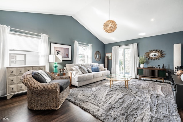 living room with dark wood-type flooring and lofted ceiling