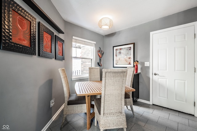 tiled dining space with baseboards