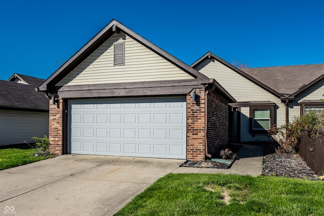 ranch-style home with an attached garage, driveway, and brick siding