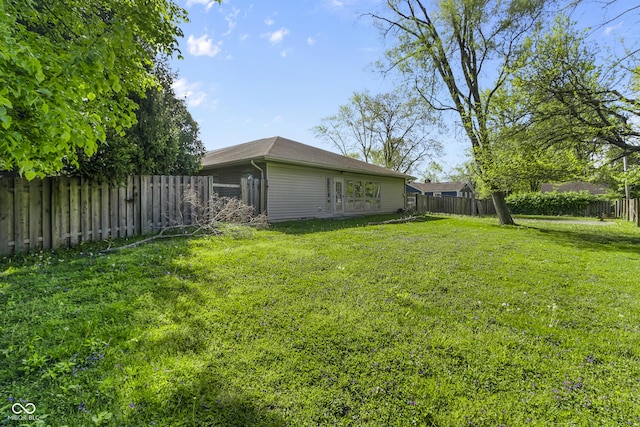 view of yard with a fenced backyard