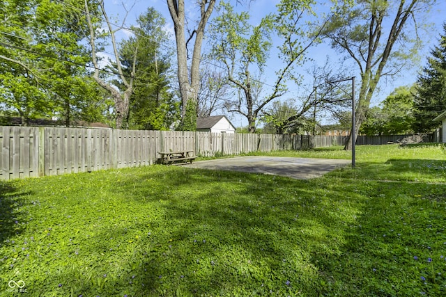 view of yard featuring a patio area and a fenced backyard