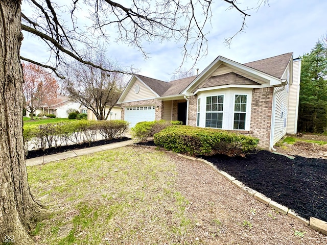 ranch-style house with an attached garage, roof with shingles, driveway, and brick siding