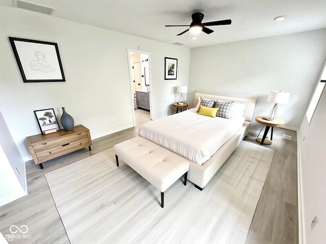 10200 Cheswick Ln, Fishers, IN 46037 - bedroom with light wood finished floors, baseboards, connected bathroom, and a ceiling fan