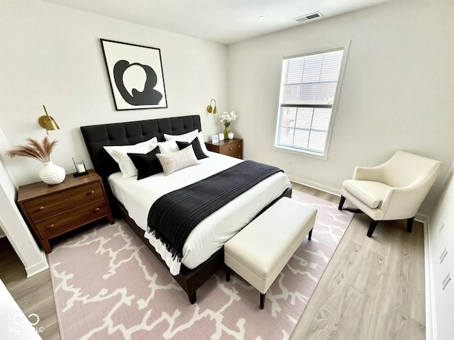 10200 Cheswick Ln, Fishers, IN 46037 - bedroom with light wood-type flooring and baseboards