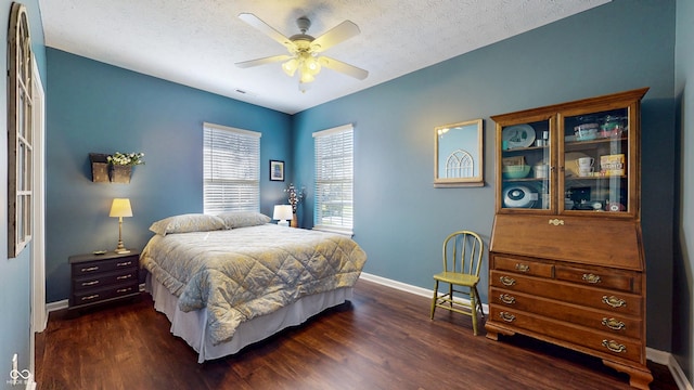 7971 Cool Hollow Pl, Indianapolis, IN 46237 - bedroom featuring baseboards, dark wood-style flooring, and a textured ceiling