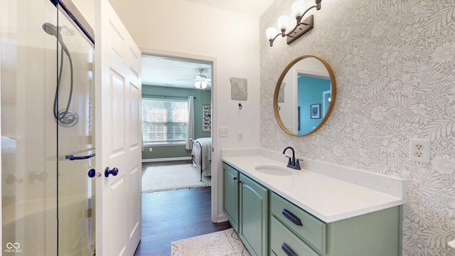 7971 Cool Hollow Pl, Indianapolis, IN 46237 - full bath with baseboards, wallpapered walls, a ceiling fan, wood finished floors, and vanity