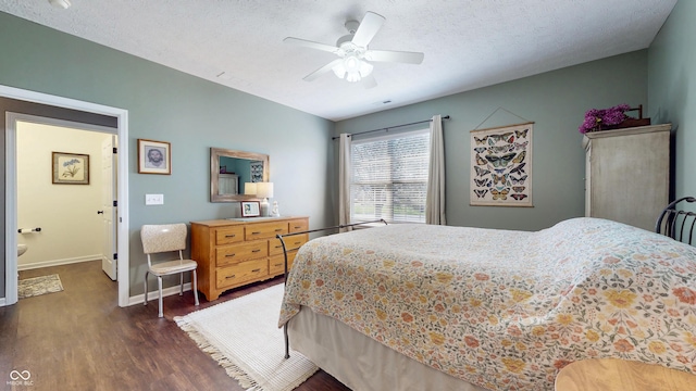 7971 Cool Hollow Pl, Indianapolis, IN 46237 - bedroom with dark wood-type flooring, baseboards, ceiling fan, and a textured ceiling