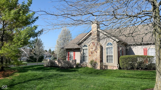 7971 Cool Hollow Pl, Indianapolis, IN 46237 - view of front of house with a chimney and a front lawn