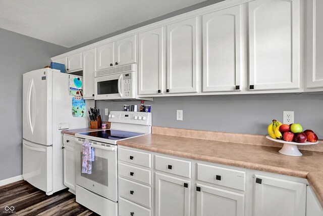 kitchen featuring white cabinets, dark wood-style flooring, white appliances, and light countertops