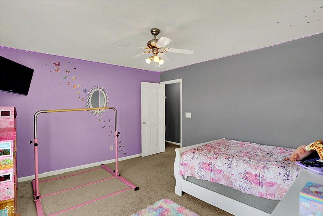 carpeted bedroom with baseboards and ceiling fan