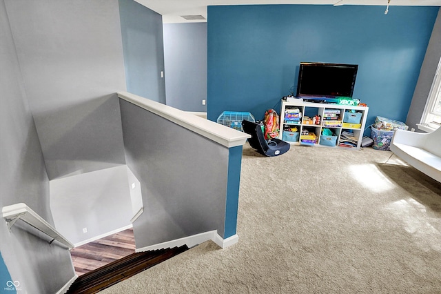 rec room with visible vents and carpet