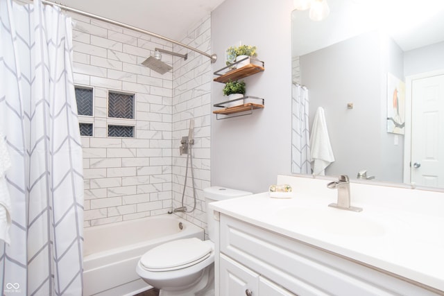 bathroom with vanity, toilet, and shower / tub combo