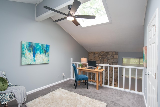 carpeted office featuring baseboards, a ceiling fan, and lofted ceiling with skylight