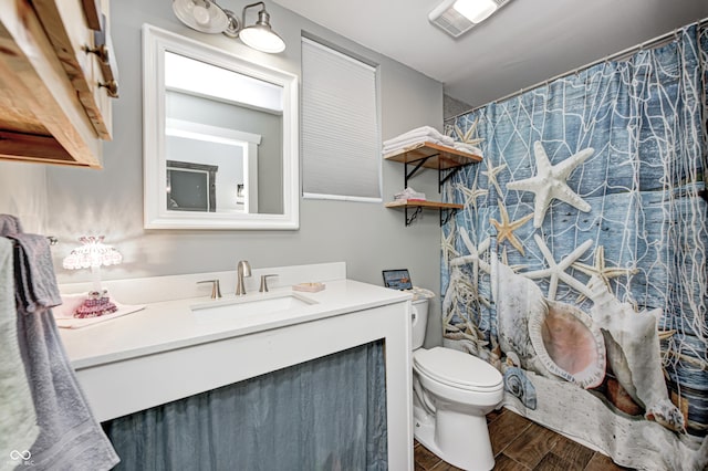 3864 N US Highway 231, Greencastle, IN 46135 - full bathroom with a shower with shower curtain, vanity, toilet, visible vents, and wood finished floors