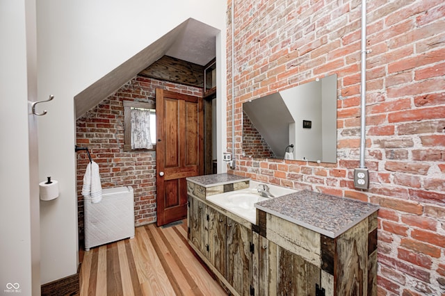 3864 N US Highway 231, Greencastle, IN 46135 - kitchen featuring light wood-type flooring, brick wall, and a sink