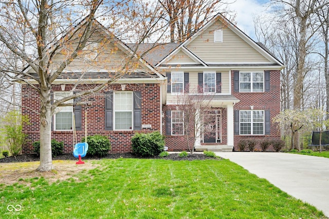 7714 Black Walnut Dr, Avon, IN 46123 - georgian-style home featuring a trampoline, a front yard, and brick siding