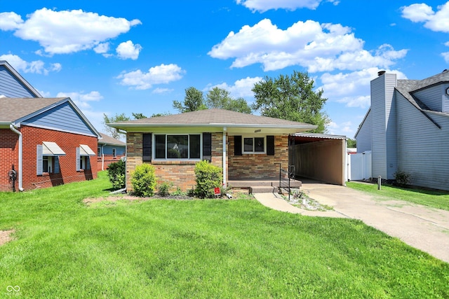 3809 Wildwood Dr, Indianapolis, IN 46239 - view of front of property featuring driveway, a front lawn, brick siding, and a carport