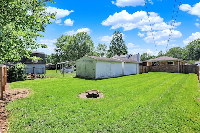 3809 Wildwood Dr, Indianapolis, IN 46239 - view of yard featuring a fire pit