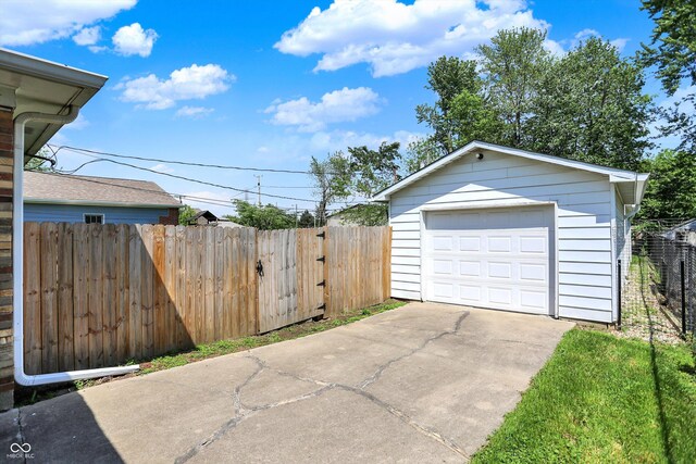 3809 Wildwood Dr, Indianapolis, IN 46239 - detached garage with concrete driveway