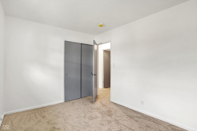 3809 Wildwood Dr, Indianapolis, IN 46239 - unfurnished bedroom featuring carpet floors, baseboards, and a closet