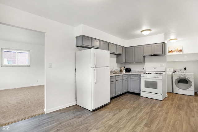 3809 Wildwood Dr, Indianapolis, IN 46239 - kitchen featuring white appliances, gray cabinetry, washer / clothes dryer, and light countertops