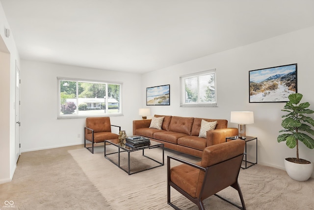 3809 Wildwood Dr, Indianapolis, IN 46239 - living room featuring healthy amount of natural light, light colored carpet, and baseboards