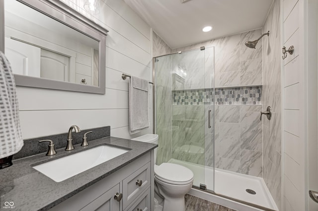 4644 Shelby Cir, Greenwood, IN 46143 - full bathroom featuring toilet, recessed lighting, a shower stall, vanity, and wood finished floors