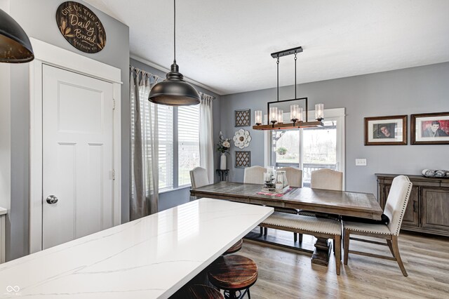 4644 Shelby Cir, Greenwood, IN 46143 - dining room featuring light wood-type flooring and an inviting chandelier