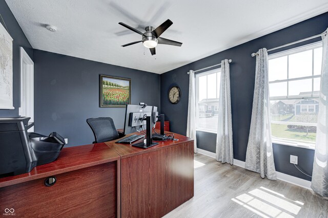 4644 Shelby Cir, Greenwood, IN 46143 - office area with light wood finished floors, baseboards, and a ceiling fan