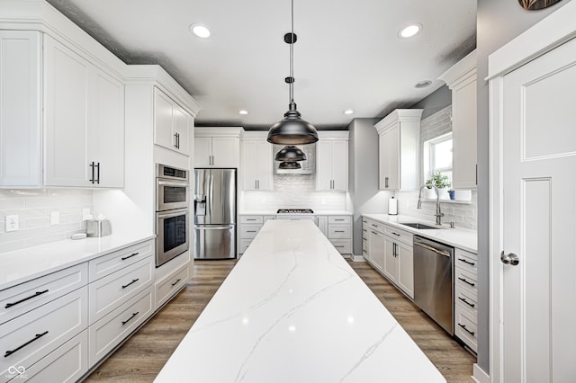 4644 Shelby Cir, Greenwood, IN 46143 - kitchen with a sink, decorative backsplash, and appliances with stainless steel finishes