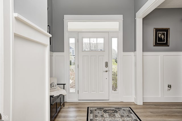 4644 Shelby Cir, Greenwood, IN 46143 - foyer with a decorative wall, a wainscoted wall, and light wood-type flooring
