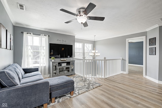 4644 Shelby Cir, Greenwood, IN 46143 - living room featuring visible vents, a wealth of natural light, light wood-style floors, and a textured ceiling