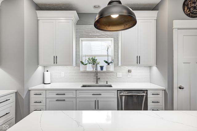 4644 Shelby Cir, Greenwood, IN 46143 - kitchen with tasteful backsplash, dishwasher, white cabinetry, and light stone countertops