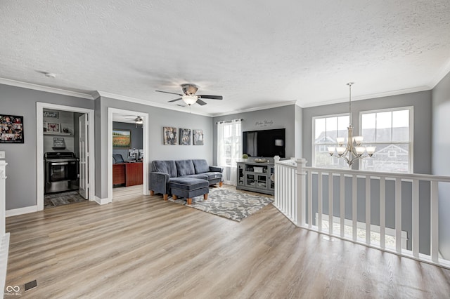 4644 Shelby Cir, Greenwood, IN 46143 - living area featuring crown molding, baseboards, wood finished floors, and a textured ceiling