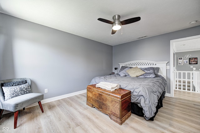4644 Shelby Cir, Greenwood, IN 46143 - bedroom with wood finished floors, baseboards, a ceiling fan, and visible vents