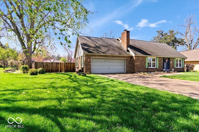 view of front of house with fence, a front lawn, brick siding, an attached garage, and a chimney