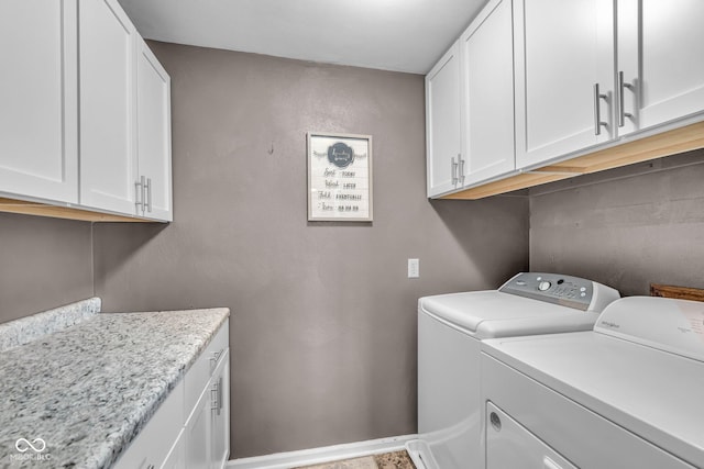 laundry area featuring cabinet space and washer and clothes dryer