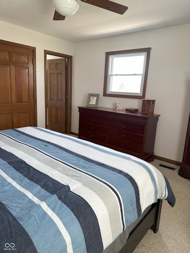 bedroom with visible vents and carpet floors
