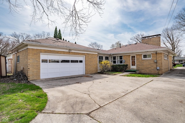 view of front of home featuring concrete driveway, a chimney, an attached garage, brick siding, and a shingled roof