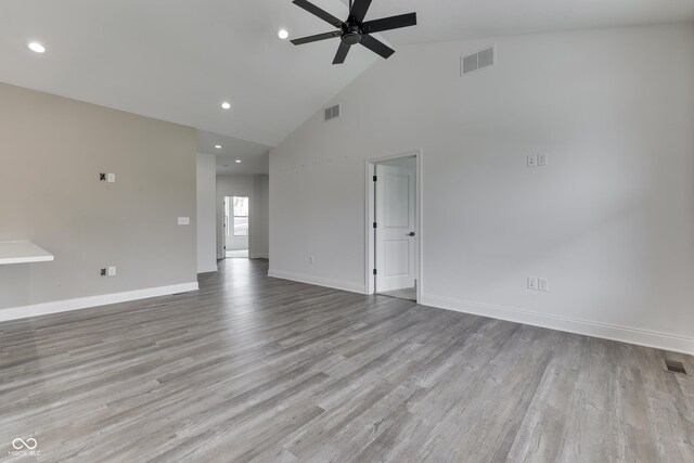 2144 Connie Ct, Franklin, IN 46131 - unfurnished room with a ceiling fan, baseboards, high vaulted ceiling, recessed lighting, and wood finished floors