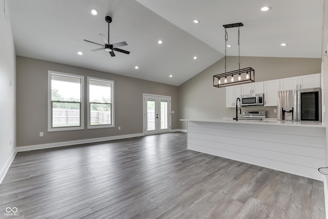 2144 Connie Ct, Franklin, IN 46131 - unfurnished living room with ceiling fan, high vaulted ceiling, wood finished floors, baseboards, and recessed lighting