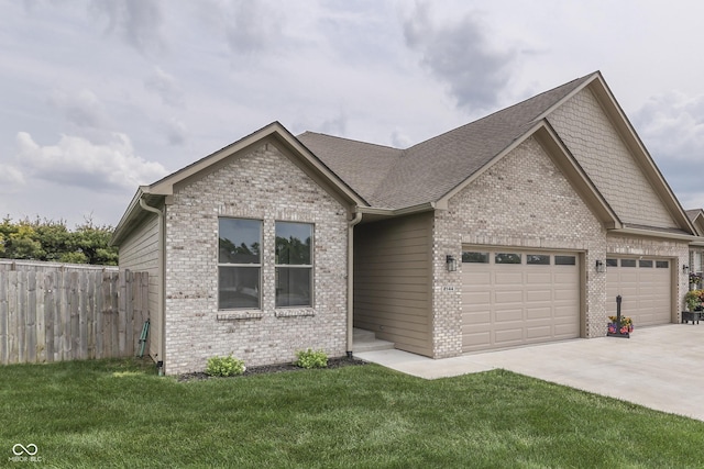 2144 Connie Ct, Franklin, IN 46131 - view of front of property with brick siding, an attached garage, and driveway