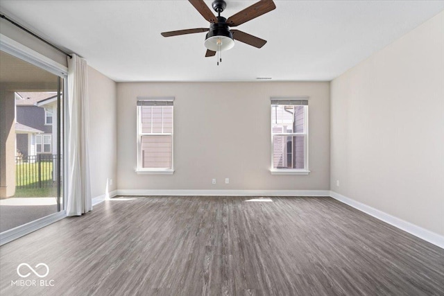 7012 Pickett Pl, Carmel, IN 46033 - unfurnished room featuring wood finished floors, ceiling fan, and baseboards