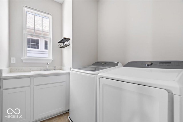 7012 Pickett Pl, Carmel, IN 46033 - washroom featuring independent washer and dryer and cabinet space