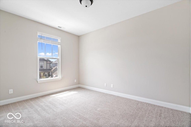 7012 Pickett Pl, Carmel, IN 46033 - spare room featuring baseboards and carpet flooring