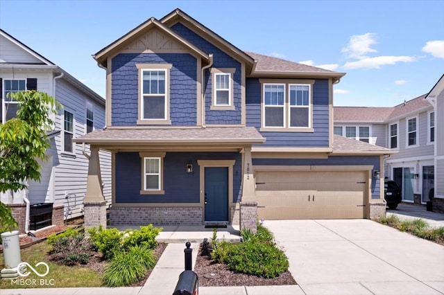 7012 Pickett Pl, Carmel, IN 46033 - craftsman-style house featuring concrete driveway, an attached garage, brick siding, a porch, and a shingled roof