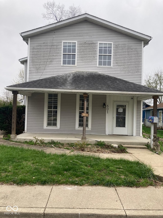 601 E Thompson St, Edinburgh, IN 46124 - farmhouse-style home featuring covered porch and roof with shingles