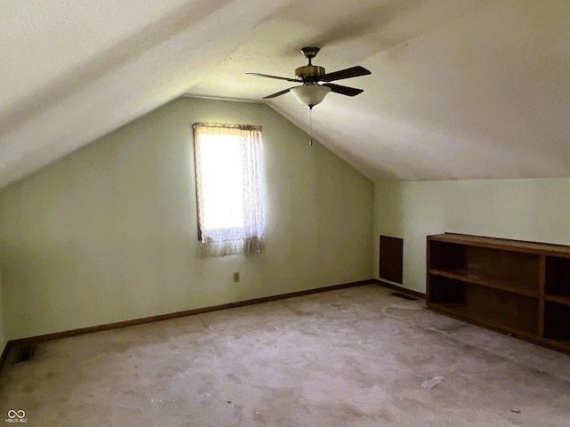 8809 Jonathon Pl, New Haven, IN 46774 - additional living space featuring vaulted ceiling, light carpet, ceiling fan, and baseboards