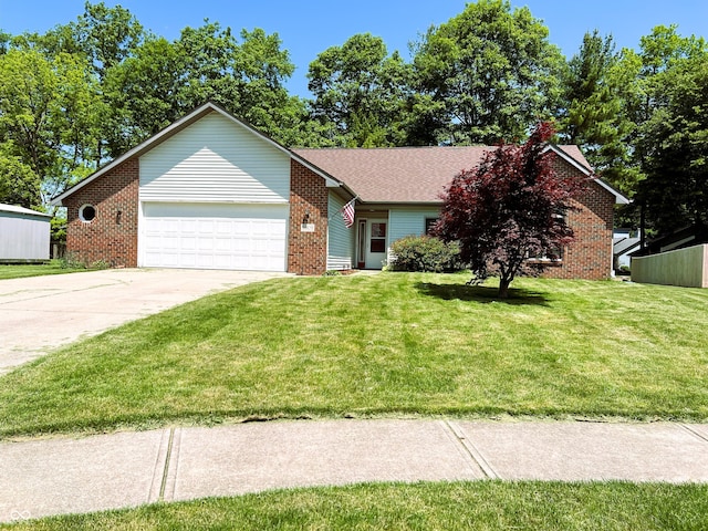 8809 Jonathon Pl, New Haven, IN 46774 - view of front facade with brick siding, a garage, a front lawn, and driveway